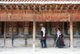 China: Pilgrims circumambulate the monastery while spinning the prayer wheels, Labrang Monastery, Xiahe, Gansu province
