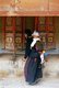 China: Pilgrims circumambulate the monastery while spinning the prayer wheels, Labrang Monastery, Xiahe, Gansu province